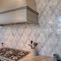 Modern kitchen with gas stovetop and hood