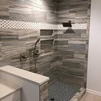 Modern bathroom shower with gray tile